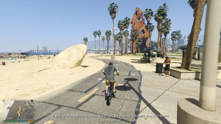 Michael rides a bicycle along Vespucci Beach while an English subtitle appears
