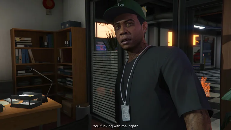 Lamar looks surprised during a GTA V cutscene with an English subtitle